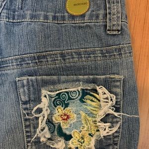 Montero bell bottom capri jeans with embroidered back pockets.